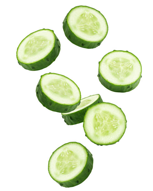 istock Falling cucumber slice isolated on white background, clipping path, full depth of field 1432560481
