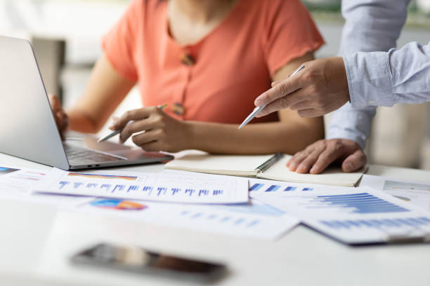 istock Business accountants are coaching laptop-based apprentices on tax systems, financial accounting and budget management. 1432568729