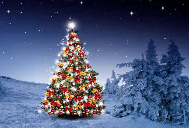 istock Shiny Christmas tree against a blue background in the snow 1432573855