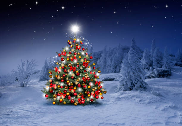 istock Shiny Christmas tree against a blue background in the snow 1432573860