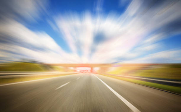istock The concept of speed and focus. Motion effect. Empty highway 1432574078