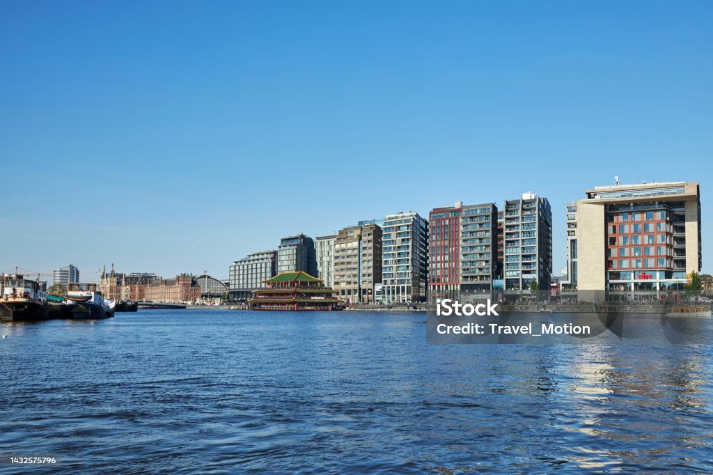 Cityscape of Oosterdokskade waterfront architecture in Amsterdam Cityscape of Oosterdokskade waterfront architecture in Amsterdam, The Netherlands Amsterdam Stock Photo