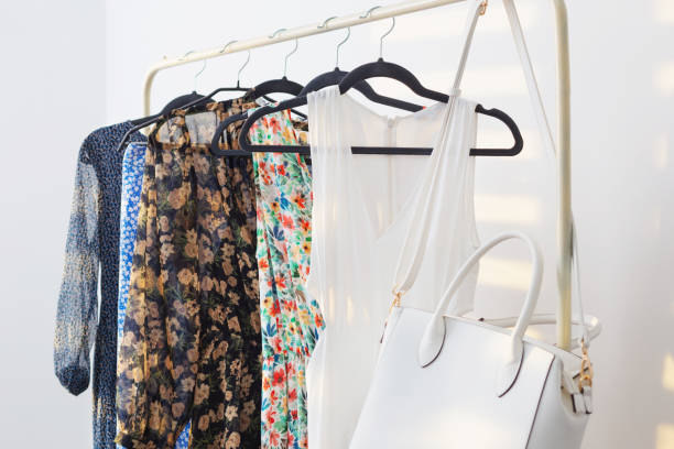 istock summer dresses on hangers on white background 1432579723