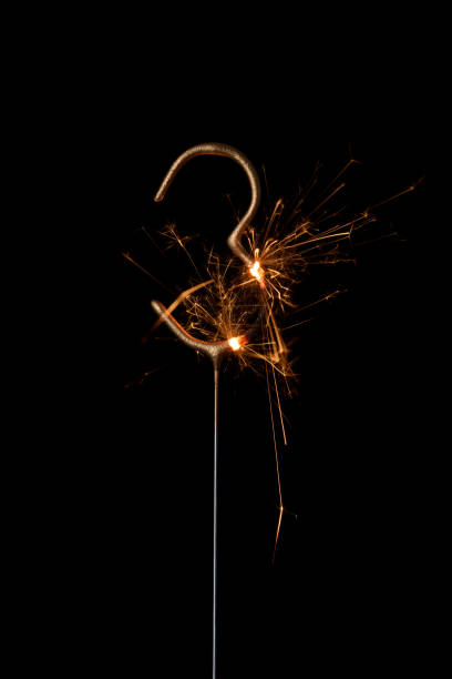 istock Burning golden sparkler in shape of number three, digit 3, isolated 1432581636