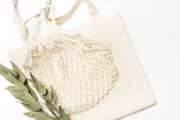 istock A blank white tote bag and a cotton mesh bag on a white background 1432582667
