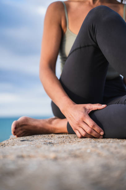 istock Unrecognizable woman resting while sitting during a yoga session. 1432583035