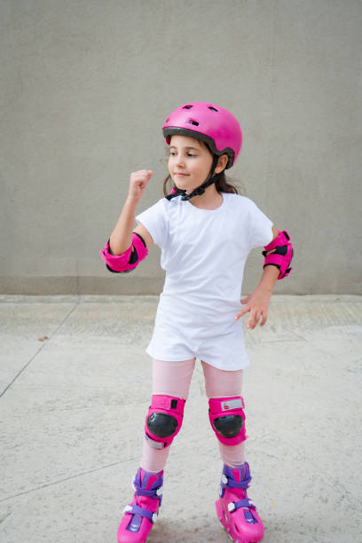 istock Cute little girl riding in roller skates 1432584483