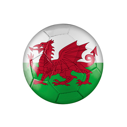 Soccer football ball with the flag of Wales participating in the World Cup on a white background.