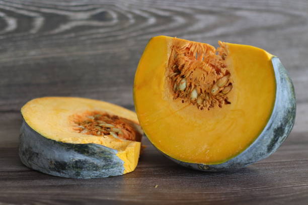 istock Sliced pumpkin. Shot on rustic wooden background 1432589834