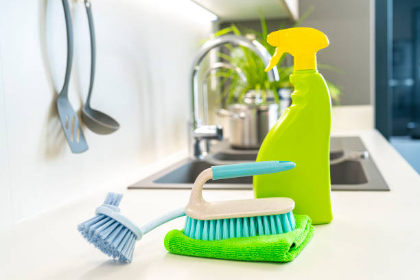 istock Scrubbing brushes, microfiber cleaning towel and spray bottle on kitchen counter 1432590799