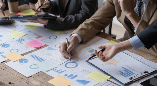 istock Close up of Business team analyzing income charts and graphs with modern laptop computer. Business analysis and strategy concept. 1432590881