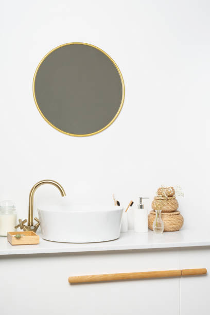 istock Bathroom marble counter with sink, candles and toothbrushes near white wall, copy space 1432594239