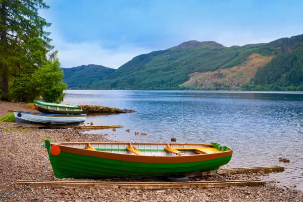Loch Ness beached boats in Scotland Highlands UK famous for the Nessie monster sightings,