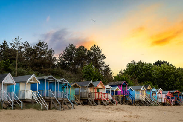 wells-next-the-sea wells-next-the-sea Beach Huts at sunset pretty beach house stock pictures, royalty-free photos & images