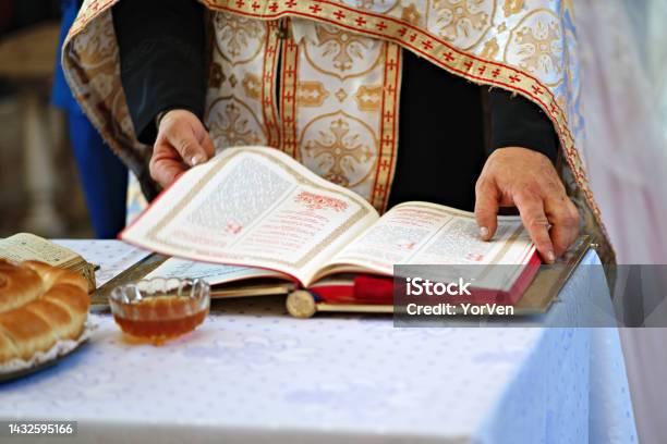 Orthodox Religion Hands Of The Priest On The Bible Stock Photo - Download Image Now