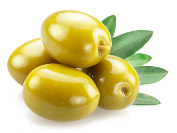istock Green olives with olive leaves isolated on white background. 1432601258