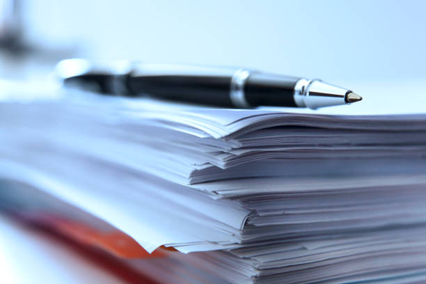 istock Ballpoint Pen Resting On Top Of Stack Of Documents 1432604828