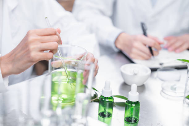 chemistry scientist working on biotechnology cosmetic research with natural herb medicine ingredient in biology science laboratory, organic bio eco beauty extract in botany experiment for dermatology stock photo