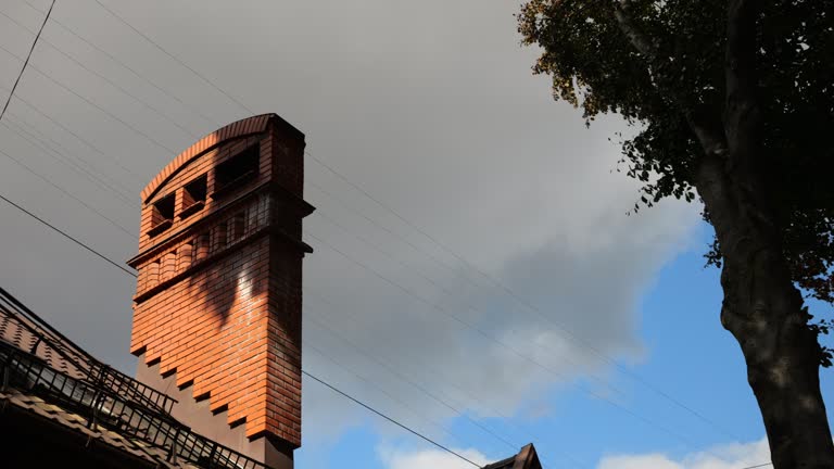 Chimney on the roof of the building. Architecture of an old European city.