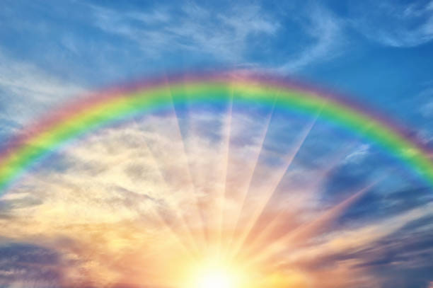 Beautiful evening sunset with rainbow Beautiful evening cloud of the sunset with a rainbow and sunshine after rain rainbow stock pictures, royalty-free photos & images