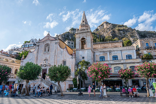 Taormina, Italy: 09-16-2022: The main squarre in Taormina with a beautiful church