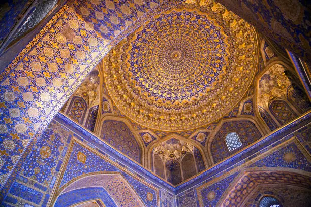 Uzbekistan, Samarkand decorated ceilings of the Till Kari Madrasa at the Register Square.