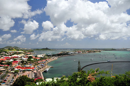 Marigot, Collectivity of Saint Martin / Collectivité de Saint-Martin, French Caribbean: panoramic of Marigot from Fort St. Louis. Important Caribbean tourist destination, benefits from its tax free port status. Looking SW along the west coast of the island of Saint-Martin, bays of Marigot and Nettlé, in the background Simpson Bay lagoon, Mt. Fortune and Dutch Sint Maarten.