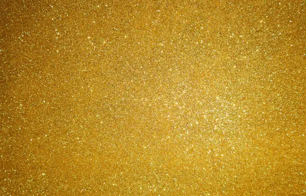 Photo of Gold glitter background. Christmas shiny background.