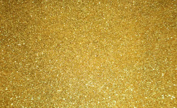 Photo of Gold glitter background. Christmas shiny background.