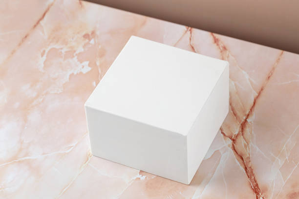 istock White squared podium, pedestal on beige pink marble background. Minimal background for product presentation. Blank, scene. Mockup. Mock up. 1432616218