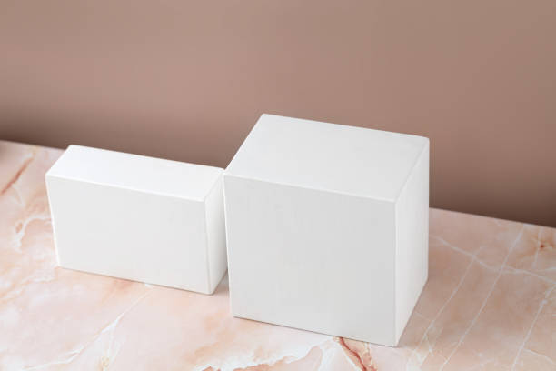 istock White squared podiums, pedestals on beige pink marble background. Minimal background for product presentation. Blank, scene. Mockup. Mock up. 1432616219
