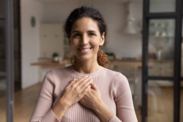 istock Head shot portrait smiling woman folded hands on chest 1432616260