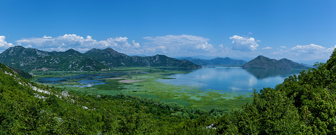 View of the lake Skadar from the mountain road, National Park in Montenegro, Europe. Beautiful sea landscapes, mountains and nature in Montenegro