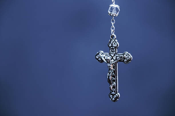 crucifix, macro photography, christian and catholic symbol, background with copyspace, image of jesus christ crucified.