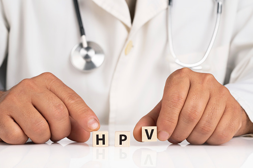 Doctor and cubes with text HPV