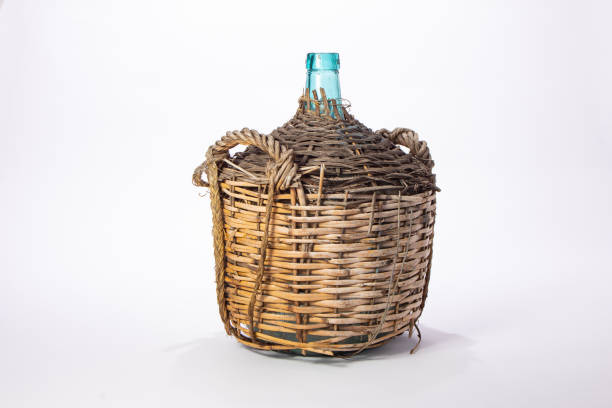 Antique demijohn on white background.