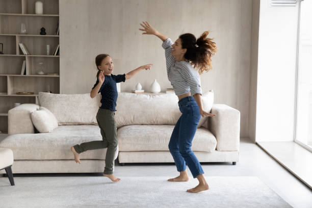 istock Excited active mom and happy daughter kid having fun 1432628705