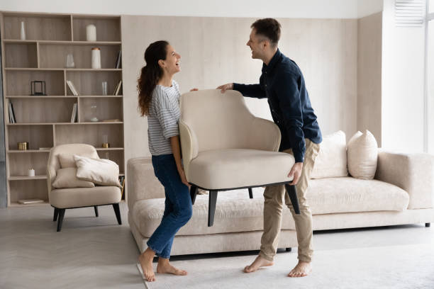 Happy married couple enjoying moving into new house