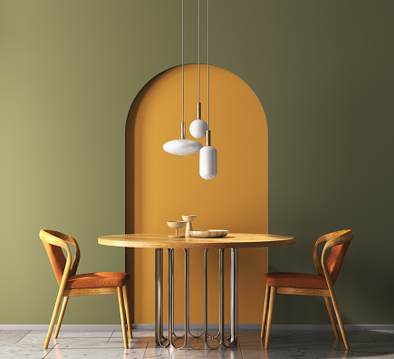 Interior design with wooden round table and chairs. Modern dining room with green and orange wall. Cafe, bar or restaurant interior design. Home interior with pendant light. 3d rendering