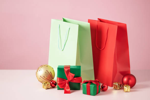 istock Holiday shopping bag and gift boxes on table. 1432633169