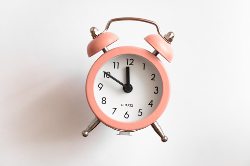 Isolated pink quartz alarm clock for design purpose