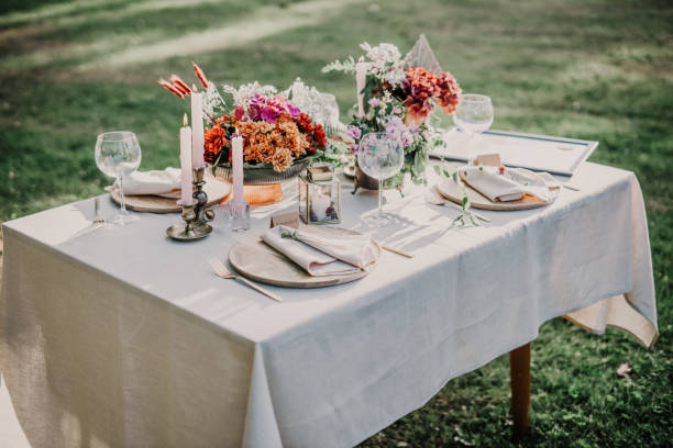 istock Modern wedding table decorated with plates, cutlery and flowers 1432633803