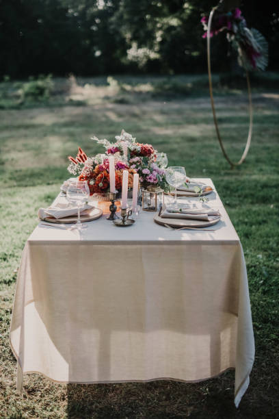 istock Modern wedding table decorated with plates, cutlery and flowers 1432633808