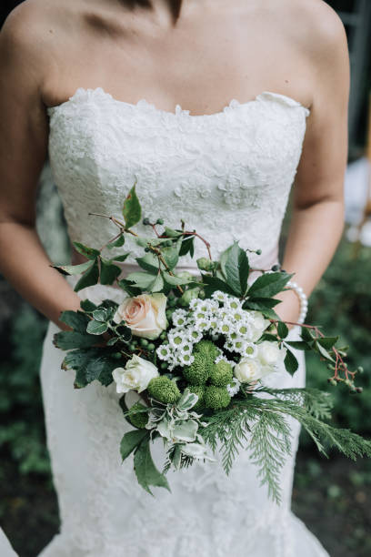 istock Young beautiful bride holding bouquet in boho style 1432633973