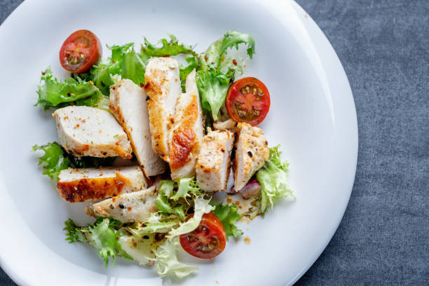 istock Salad with chicken and tomatoes 1432634142