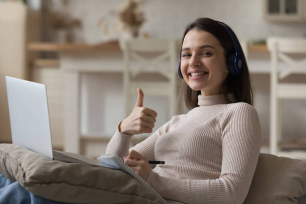 istock Happy successful student girl satisfied with online education 1432634167