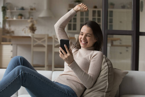 istock Excited joyful smartphone user girl getting good news 1432634202