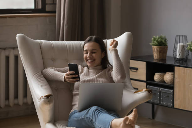 istock Happy overjoyed millennial girl making winner hand 1432634247