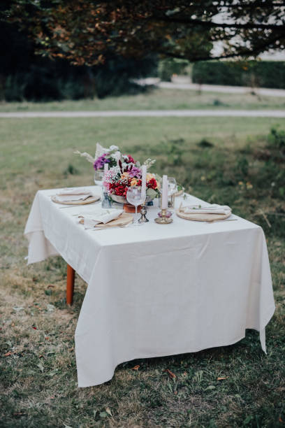 istock Modern wedding table decorated with plates, cutlery and flowers 1432634324