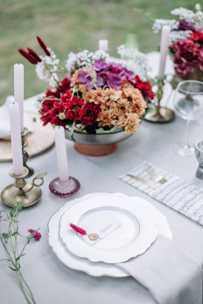 istock Modern wedding table decorated with plates, cutlery and flowers 1432634329